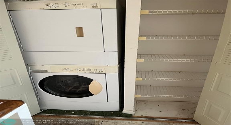 STACKABLE UNIT IN HALLWAY UPSTAIRS WITH LINEN CLOSET