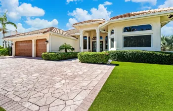 Front exterior with astroturf.