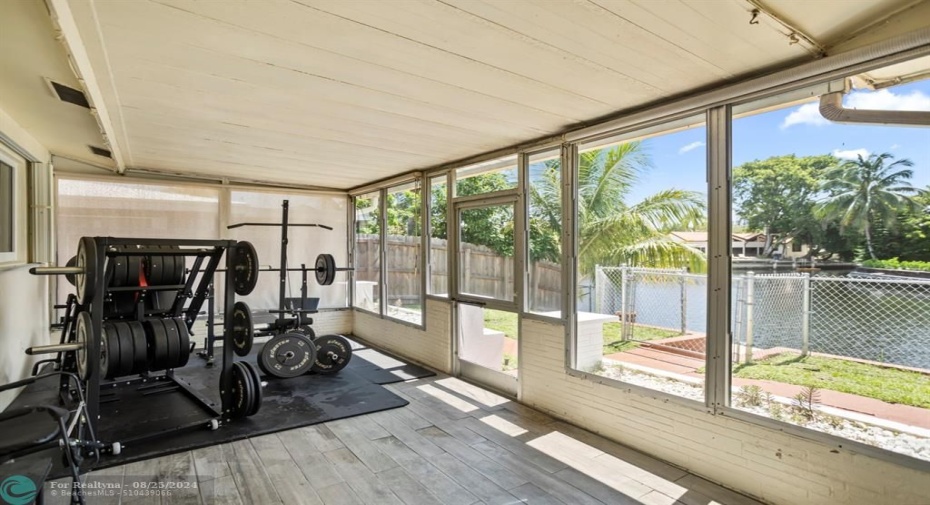 Covered screened porch with views of water