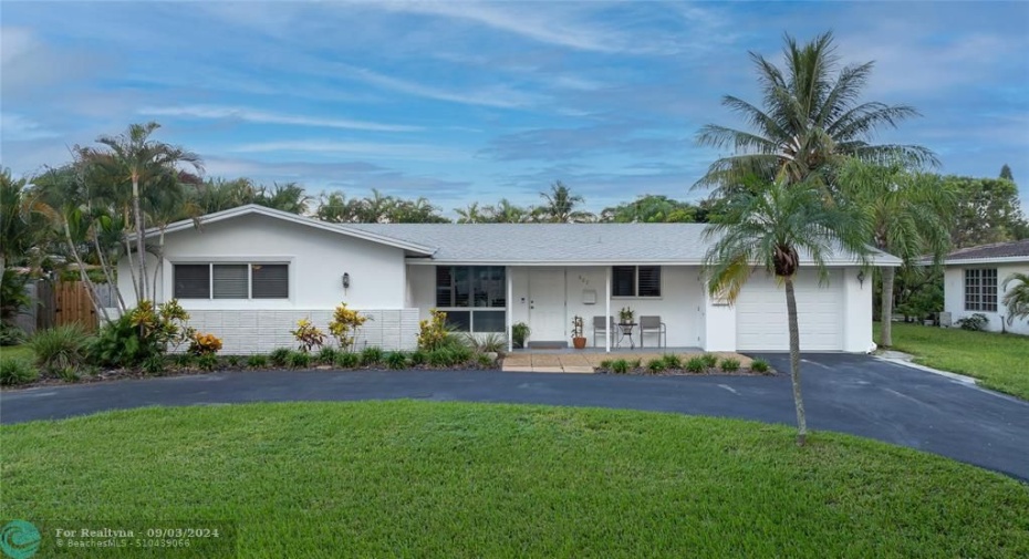 Front home facade with circular and straightaway drive (resurfaced), impact garage door, windows/doors, exterior paint, 2023 roof.