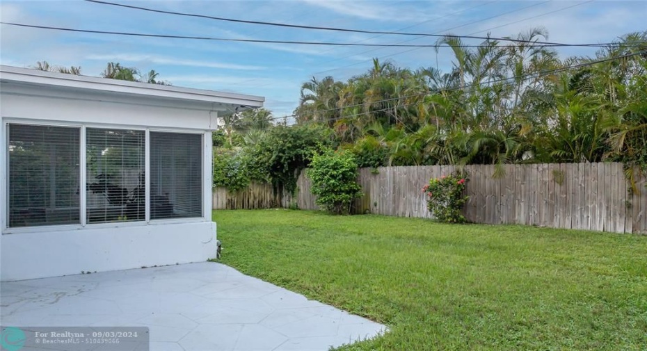 Open patio with fully fence back yard