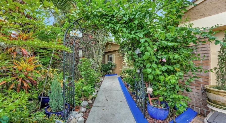 Take the whimsical archway up the path to the double front door entry; a delight for the eyes, every which way!