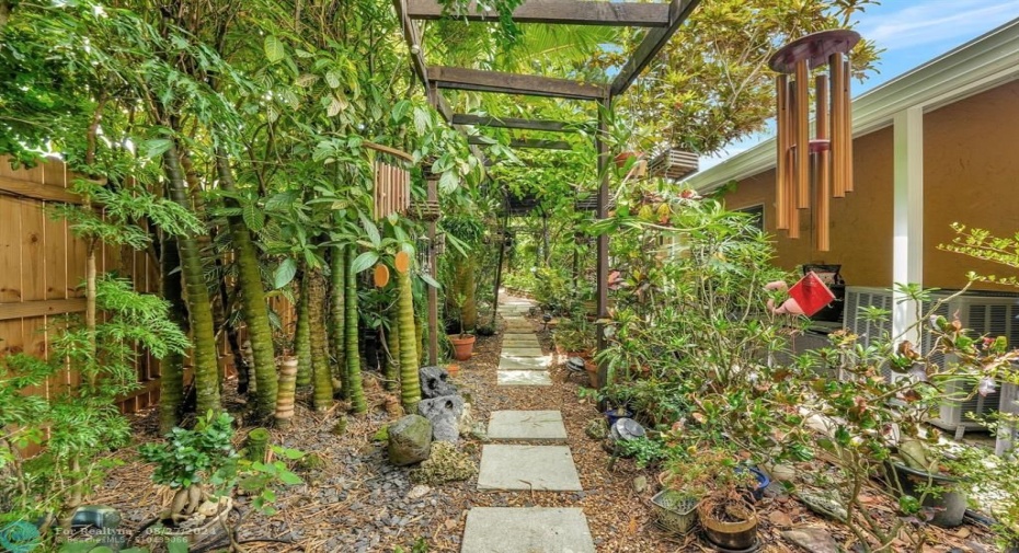 Even with the exclusion of the potted plants, there is an abundance of trees, plants, flowers to create a private lush oasis in your own backyard.