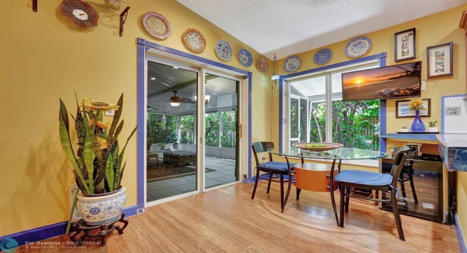 Breakfast with garden views! Plus, impact glass sliding doors lead to the 400 sq ft tiled patio, screened for year round outdoor comfort.