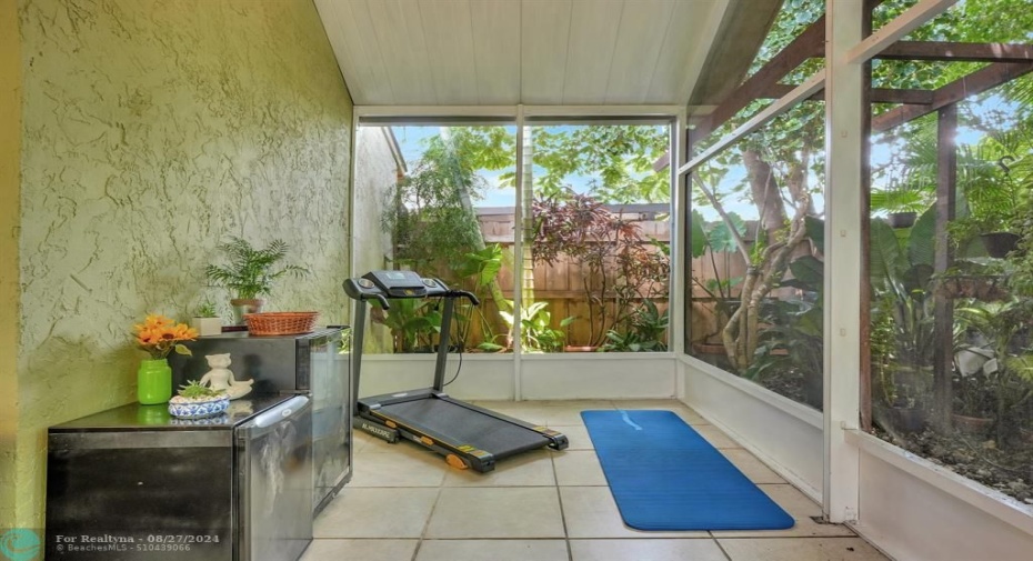 Zen yoga niche overlooks the tropical garaden.