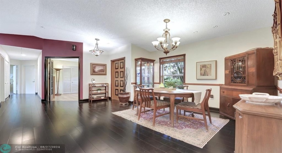 Double door entry into the open living & dining areas, with magnificent rich bamboo flooring to offset the freshly painted sections in warm white.