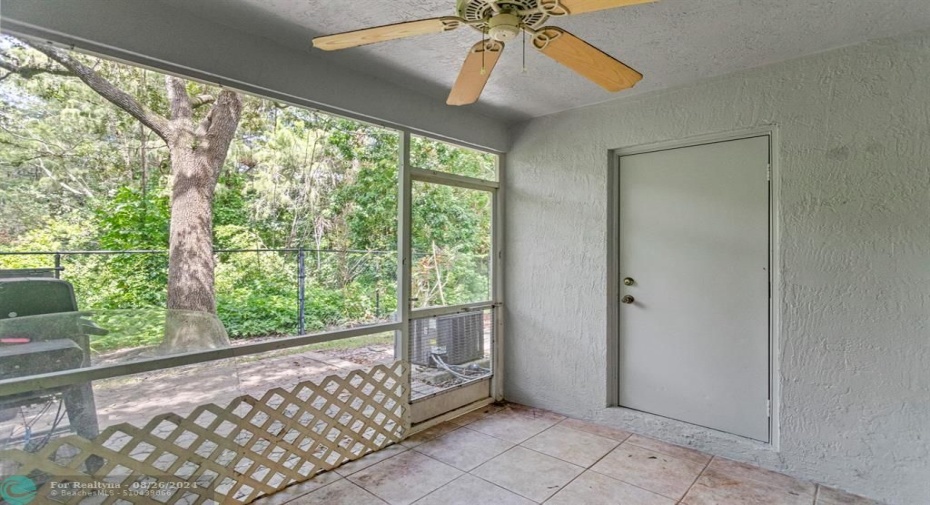 Screened in patio with closed closet for storage