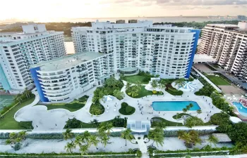 Building, pool and beach access aerial view