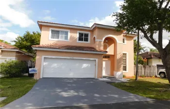 FRONT OF HOME WITH 2 CAR GARAGE