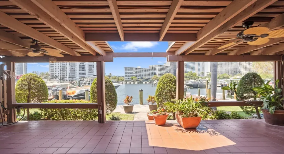 Covered Patio with lots of room to entertain or relax and watch the beautiful sunsets overlooking the deep water canal, no fixed bridges with ocean access.