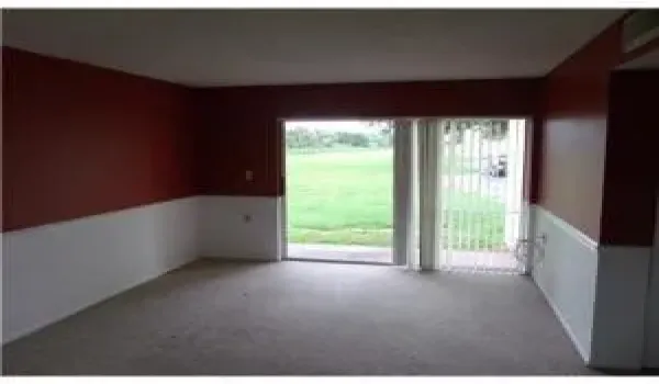 spacious living room with walkout to pat