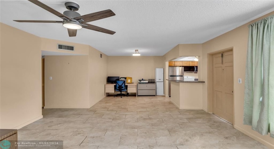 Living room, Dining room and kitchen with title flooring