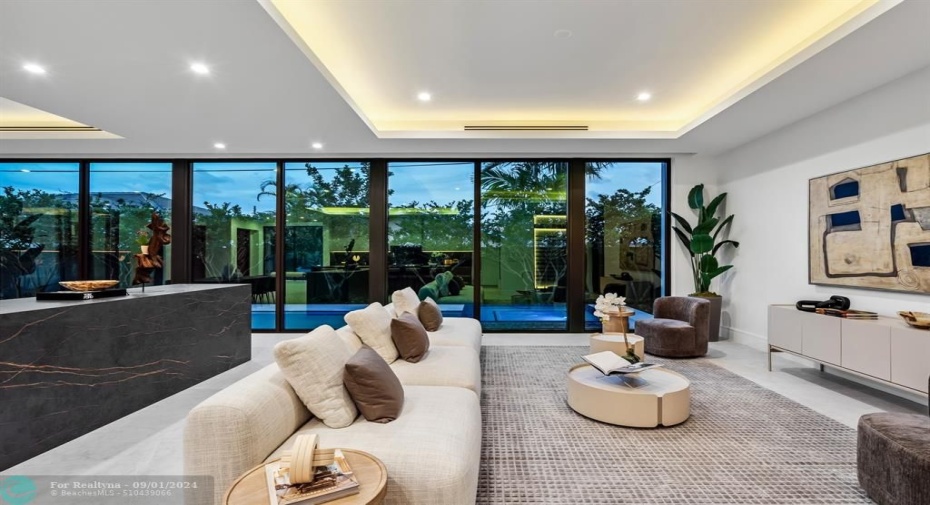 The living room with the pool outside.