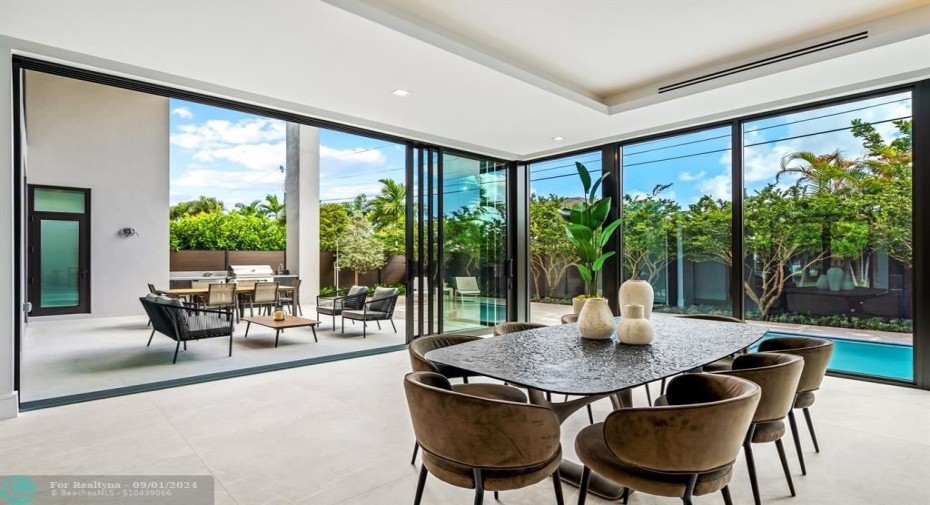 Floor to ceiling sliding glass doors.