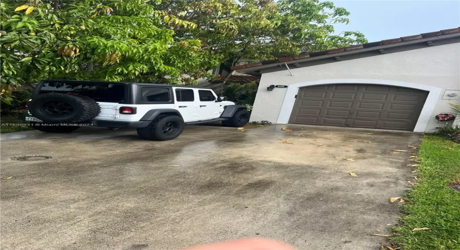 One-car garage; door operated with automatic door opener.