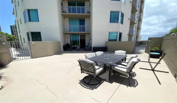 Spacious lanai - the perfect place to relax and entertain with easy access to the pool via the gated entrance