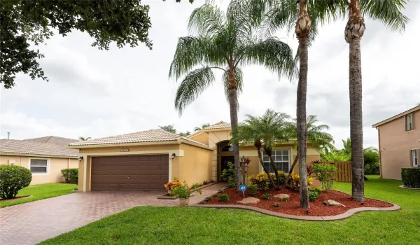 You Have Arrived!!  This Perfectly Maintained Home with Newly Sealed Driveway, Newly Painted Fencing Surrounding the Yard and Screened Pool Area.  Beautifully Planted Gardens in front and back!  Truly Special!