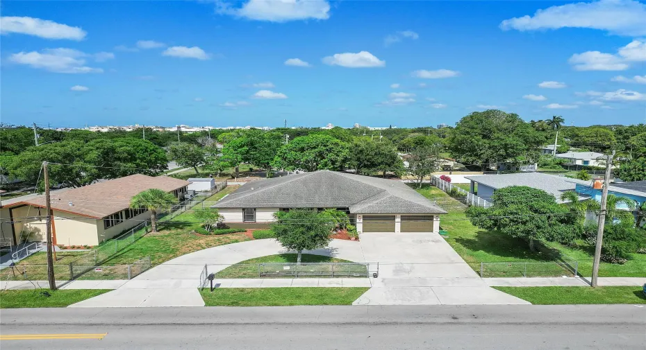 fenced yard and circular drive in addition to two car garage