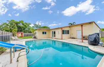 enjoy entertaining in this great backyard with pool and slide