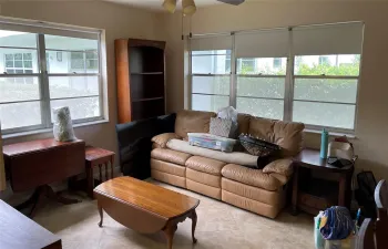 Lots of windows on this corner unit both on side and behind couch.