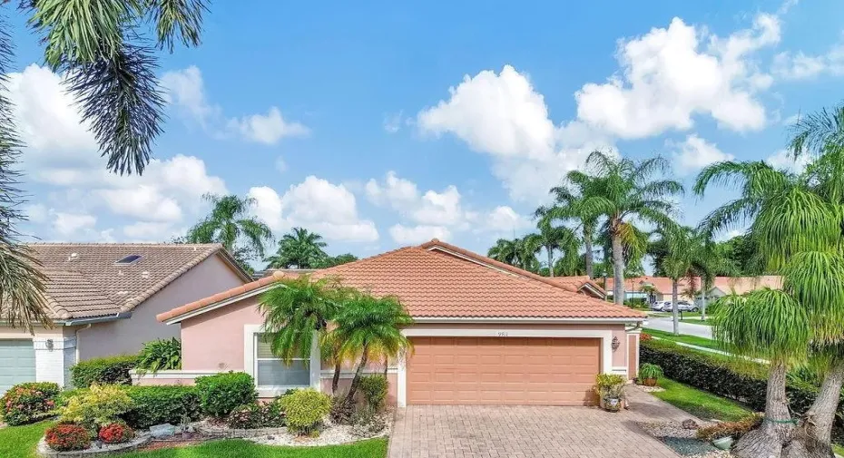 Front of your beautiful home with paver drive & lush landscaping.