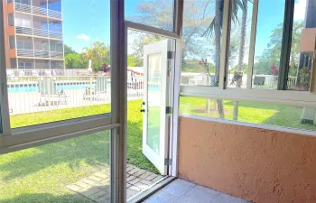 Newly enclosed patio, with impact windows and door