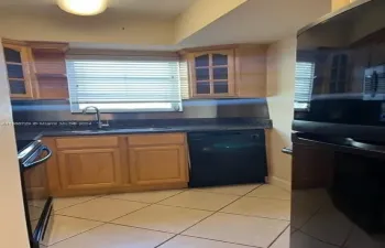 adorable mid-size kitchen.