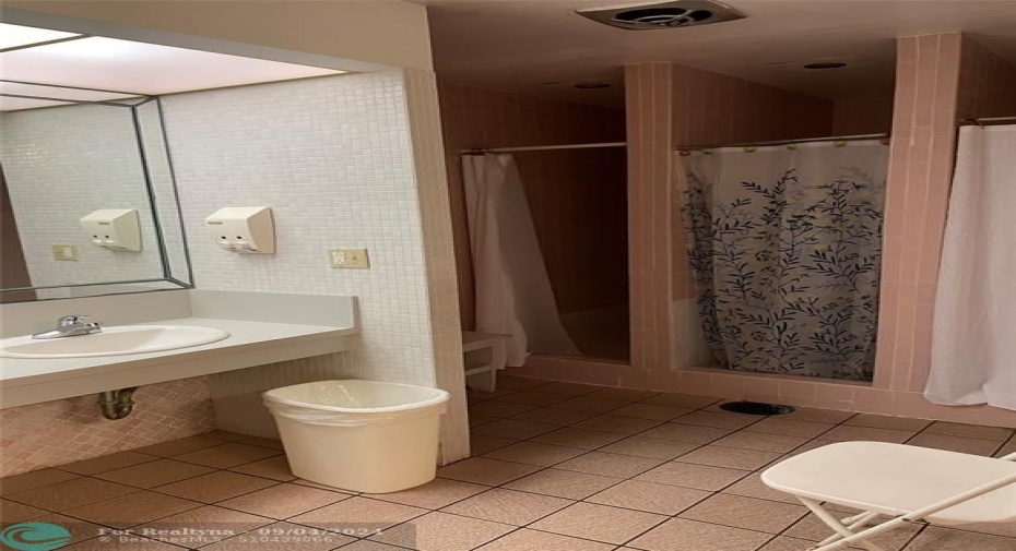 Ladies bathroom with showers and sauna