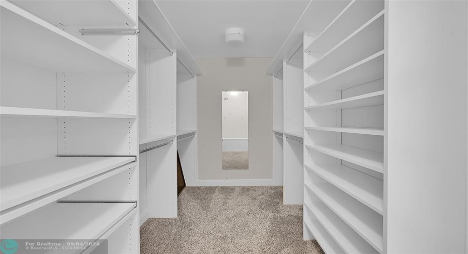 Large organized walk-in closet in primary bedroom