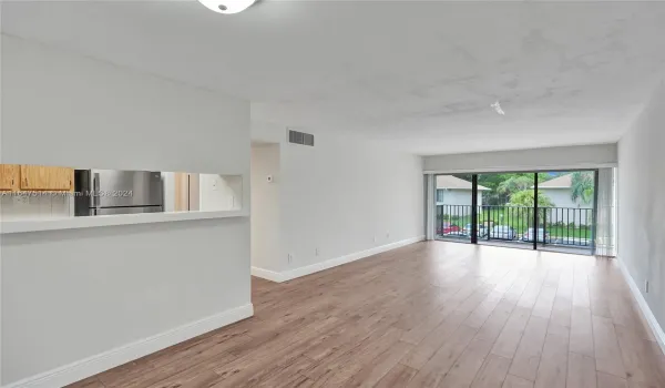 LIVING ROOM -NEW water resistant laminated floors throughout with sound proof barrier. And NEW paint throughout.