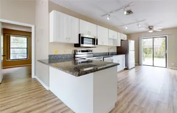 BEAUTIFUL updated kitchen with granite and SS appliances