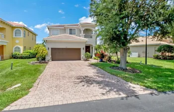 Come home to 9743 Silvercreek this two-story, modern-style house with a new brown-tiled roof, only 2 months old. This house has a two-car garage, plenty of front yard space and a drive way that accommodates 4 additional cars. The front yard is well-maintained, with lush green grass, tropical plants, and beautiful landscape all around.