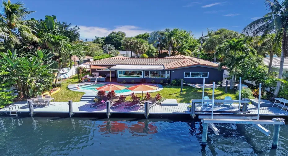 Welcome to your exclusive retreat, nestled on a prime 80' waterfront with a 177' wide canal. This impressive property sits on a impressive 9,578 sq. ft. lot, making it one of the largest waterfront homes in the neighborhood.