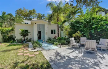 Front of the house, plenty of parking and outdoor lounge area.