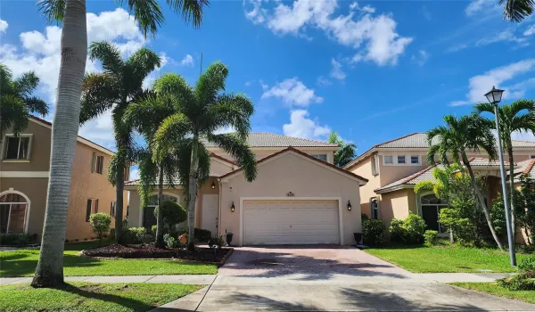 GORGEOUS WATERFRONT HOME SWEET HOME! 4-BEDROOM/3-BATH Front North exposure, paved driveway laced w/ palm trees!