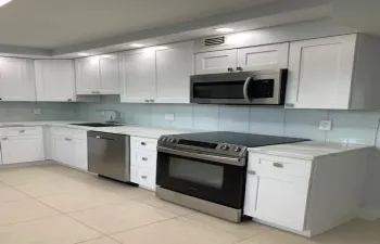 Updated kitchen with stainless steel appliances -STOVE is NEW and never used