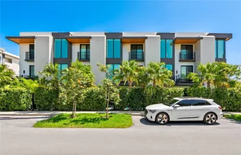 North Elevation. Listed Property is the far-right, corner residence.