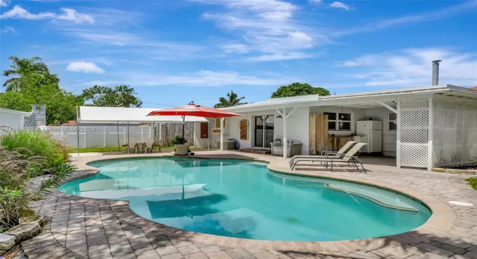 Amazing backyard w/ pavered area, pool, covered entertainment space.