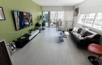 Living room with exit to balcony patio.