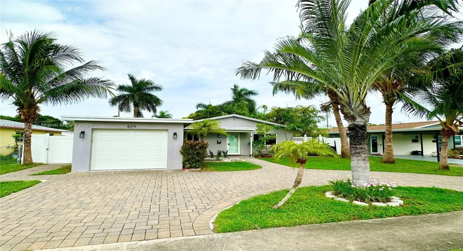 Beautiful paved circular driveway with a one car garage.