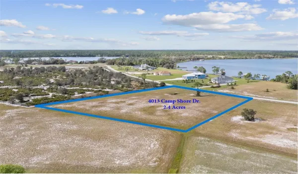 Imagine all the possibilities of building your dream home on this 2.4 acre vacant lot on a cul-de-sac street across from the serene Lake Charlotte. Enjoy the privacy of a 19-acre preserve directly along the nearly 300' long west property line of 4013 Camp Shore Drive. This image is a rendering of a potential home that may possibly be built.