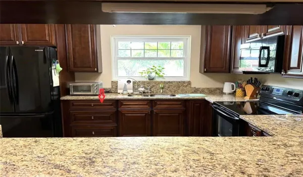 The Cabinet Next To The Refrigerator Is Separate And Not Attached To The Cabinet To The Right. The Seller Is Willing To Remove The Existing Cabinet And Install A New Dishwasher Prior To Closing.