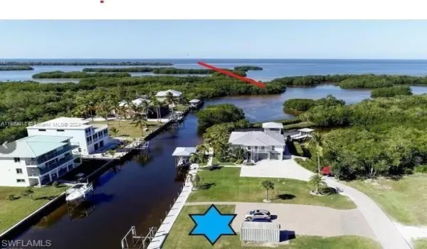 A beautiful and buildable lot - boatlift already installed, seawall in, all the hard work has been done. In addition to the incredible access, the views and birdlife are amazing - every day brings a different sunset and different birds singing! Waters are perfect for fishing and dolphins regularly play in this canal!