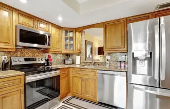 GRANITE COUNTERS, REAL WOOD CABINETS, STAINLESS APPLIANCES