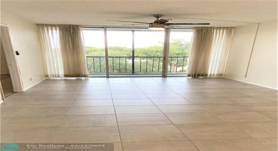 Huge living room and dining room with screened in balcony!