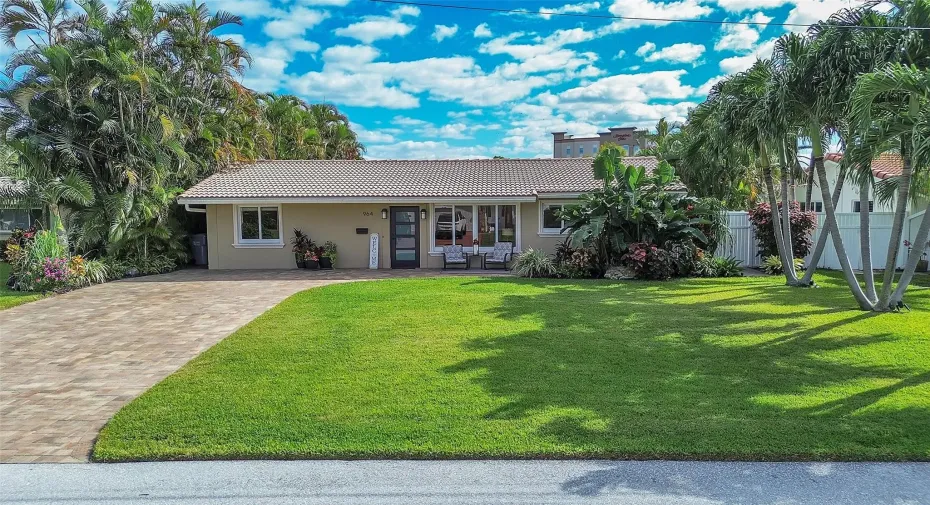 Lush healthy GREEN grass leads you to the meticulously cared driveway and entry way. You can see this is the perfect place to sit and relax and watch your kids or dog play!