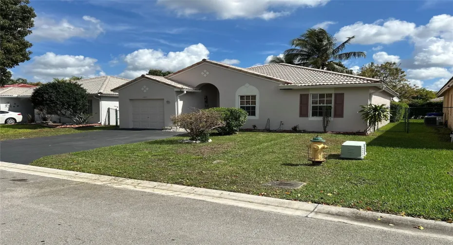 Here's a photo of the exterior with the recently sealed driveway and house exterior, freshly painted.