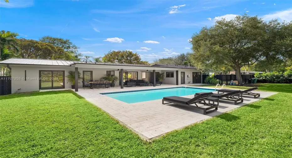 Discover this fully remodeled masterpiece in Pinecrest!