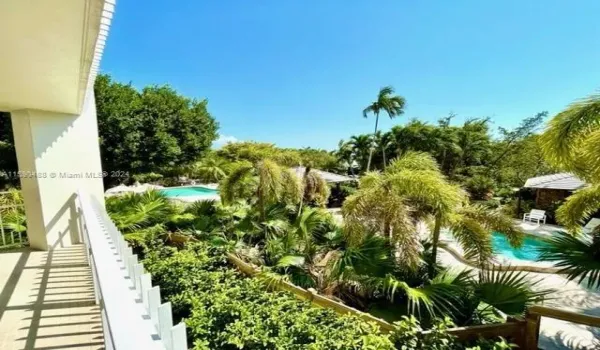 expansive views of the pool area and lush tropical gardens and fountains from every window