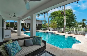 Patio faces the west with pool and lake view